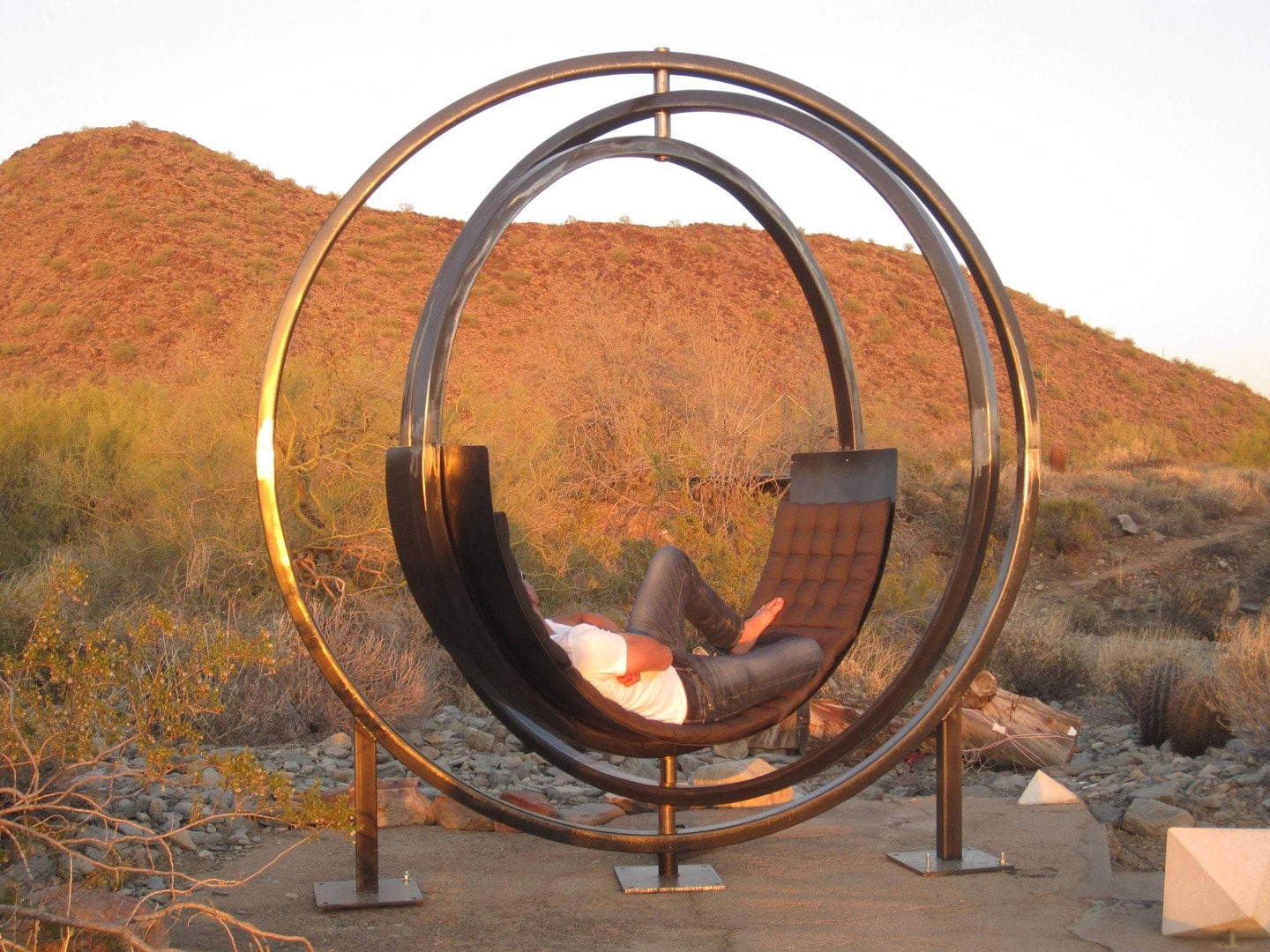 Person relaxing in Etazin circular outdoor chair
